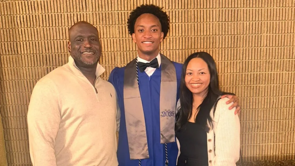 Nolan Wells, in his graduation gown, with his mother Christine Wonsley and father Elmore Wonsley.