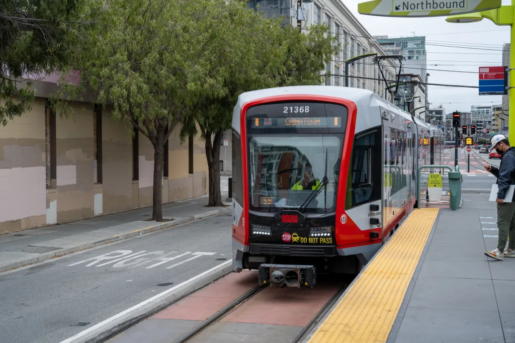 A northbound Muni Metro T Third light rail train arrives at the 4th and Brannan surface station in San Francisco.