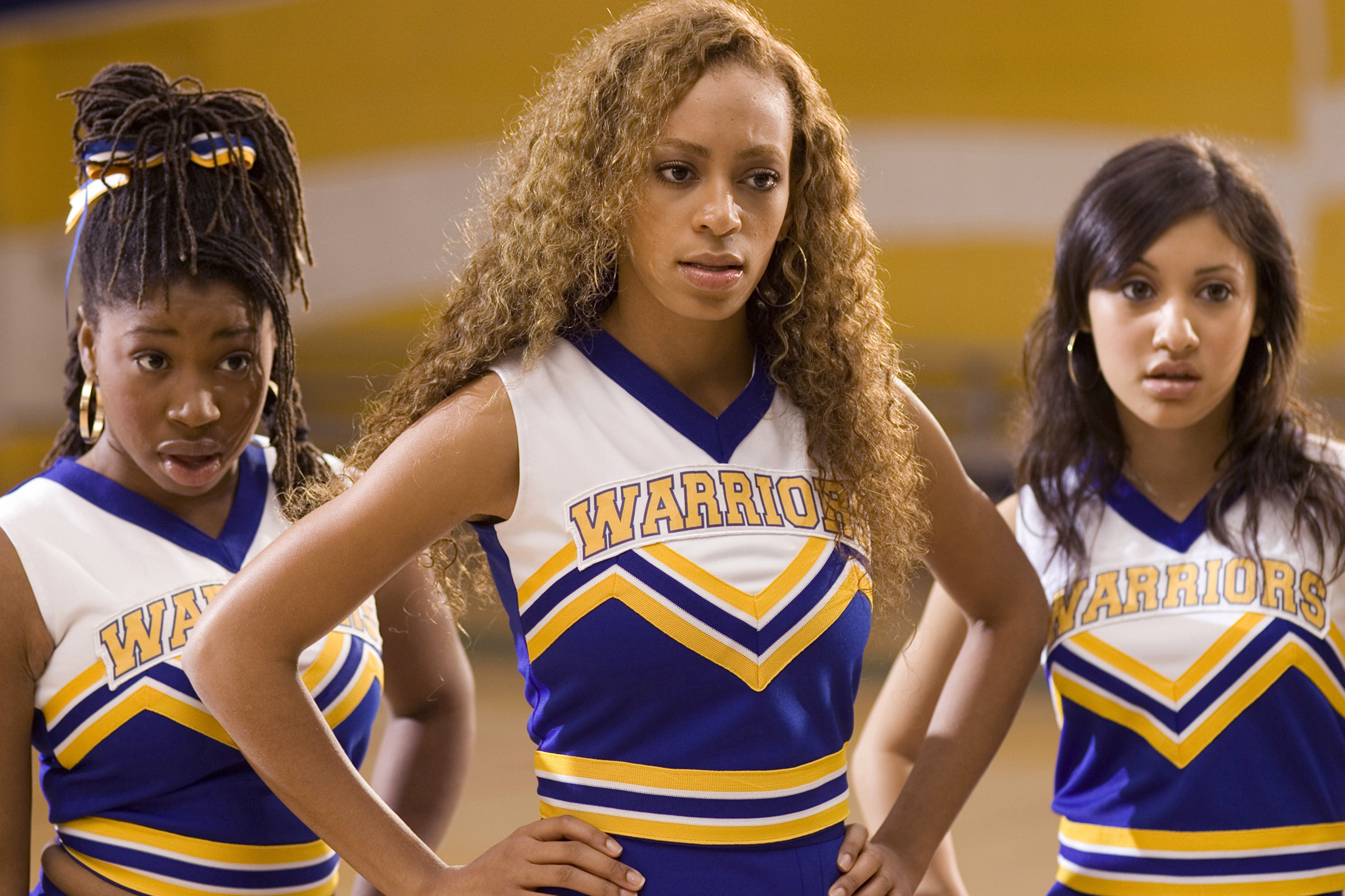Three cheerleaders in 