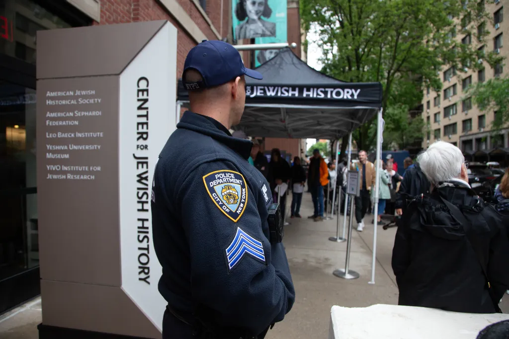 An NYPD Counterterrorism officer stands outside the Center for Jewish History.