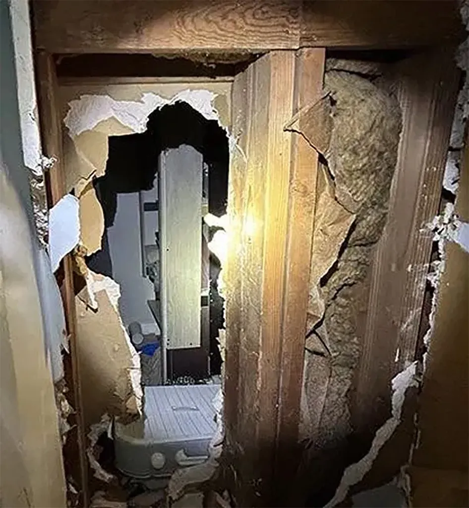 The hole left by Obed Reyes inside his apartment going into the neighbor's unit in Gainesville, Georgia.