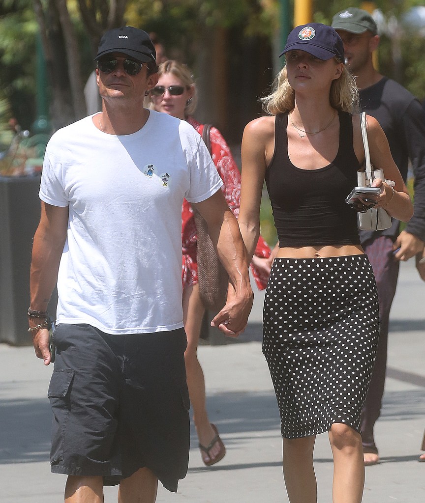 Orlando Bloom and Luisa Laemmel walking arm-in-arm in Forte dei Marmi.