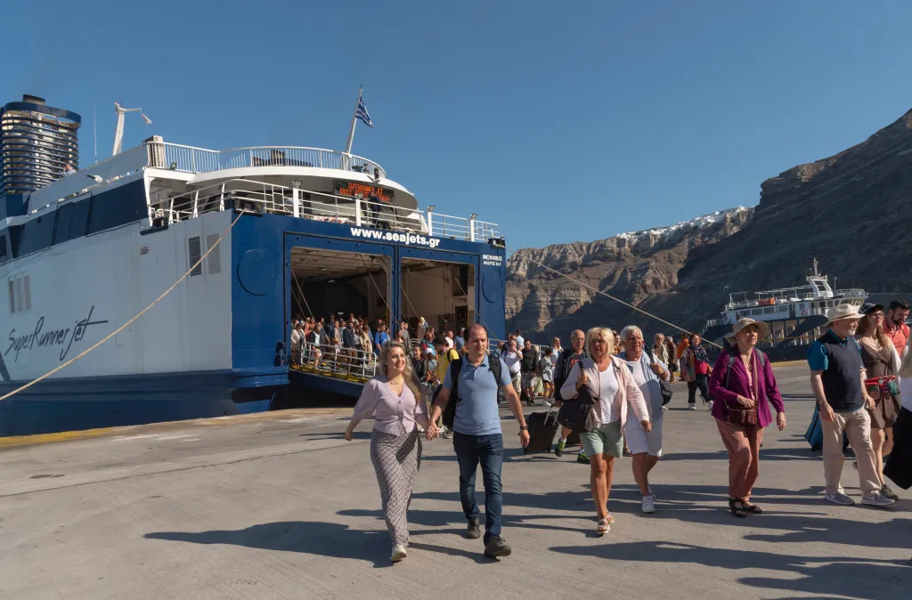 Passengers disembarking from a ferry at Athinios Port in Santorini, Greece.
