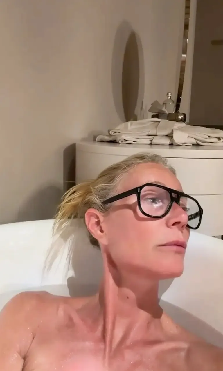 Gwyneth Paltrow topless in a bathtub.