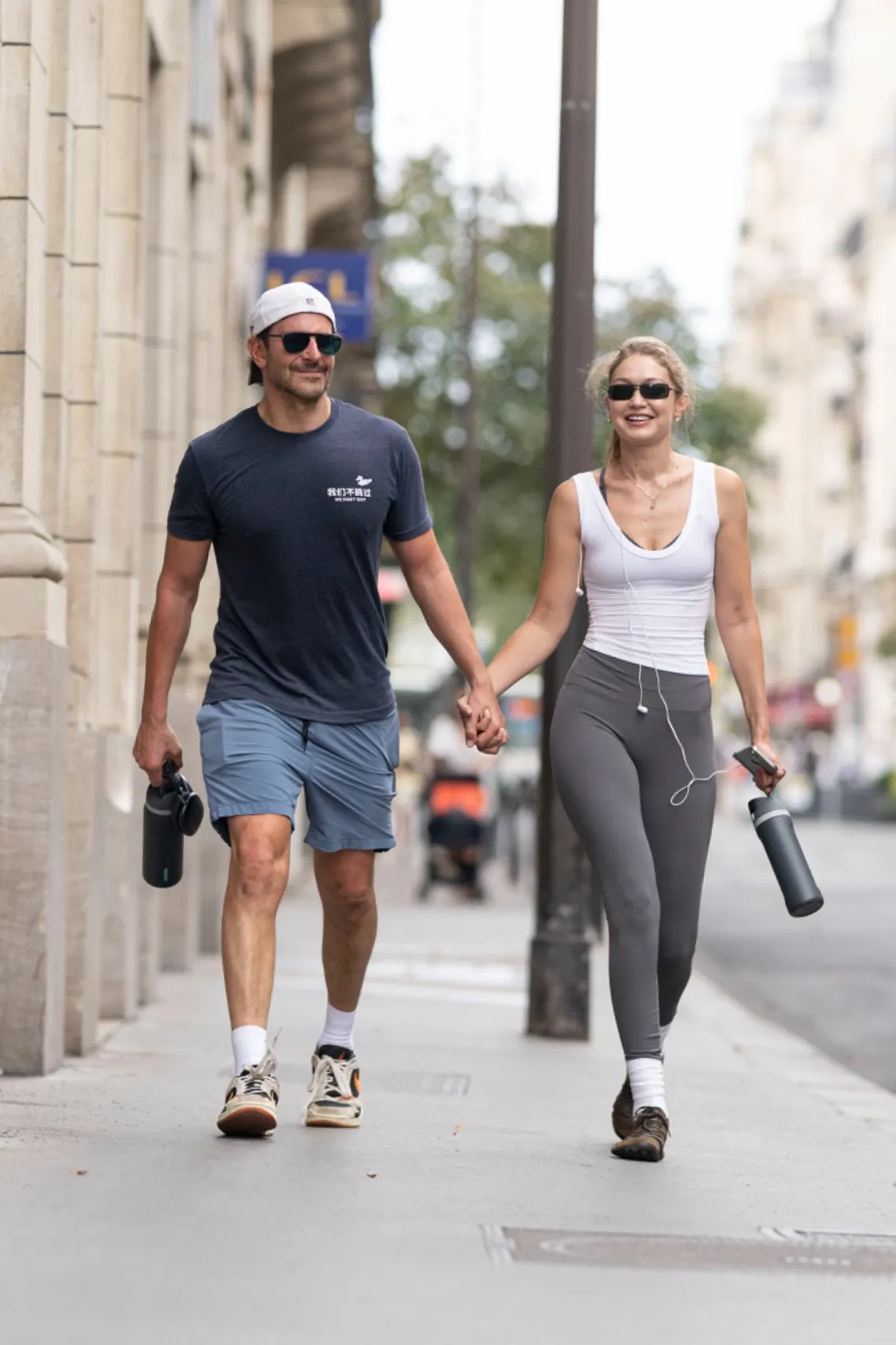 Bradley Cooper and Gigi Hadid walk hand-in-hand in Paris after a gym session.