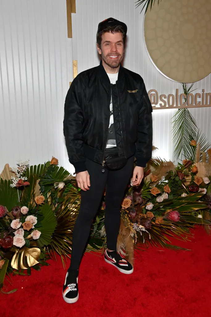 Perez Hilton smiling at the grand opening of SOL Mexican Cocina.