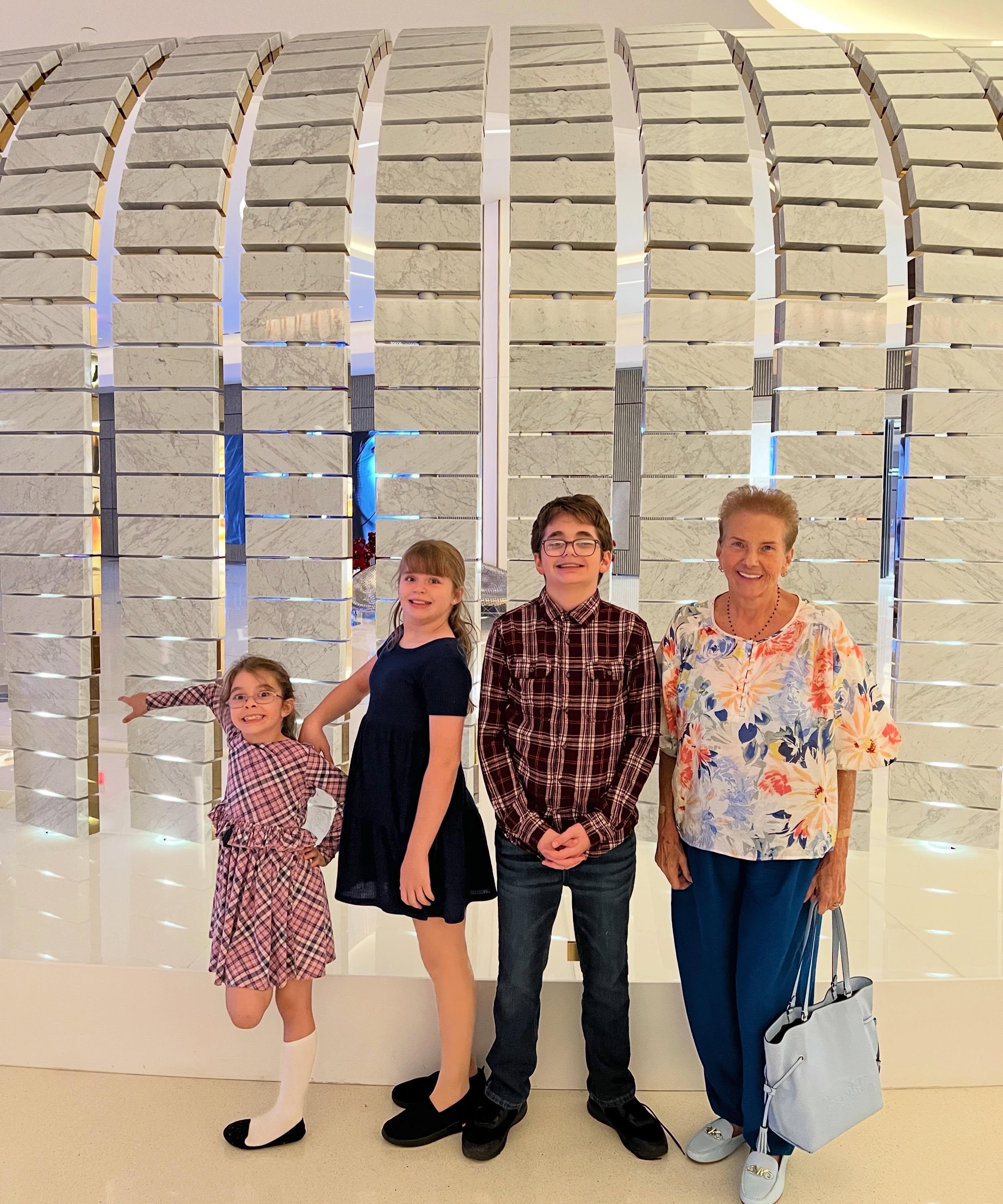 Perez Hilton's mother with his three children in a social media photo.