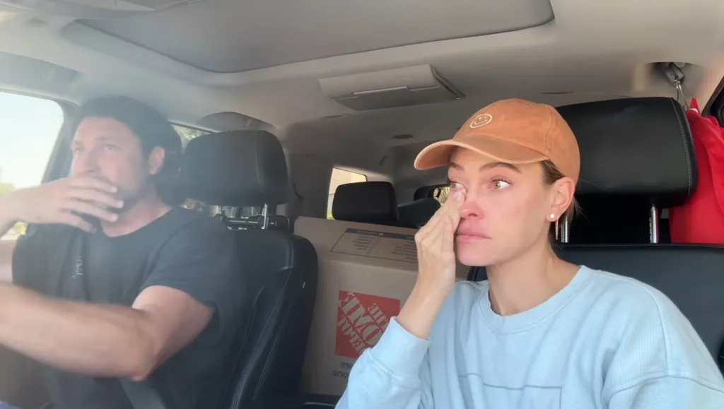 Peta Murgatroyd wiping tears from her eyes while Maksim Chmerkovskiy drives.
