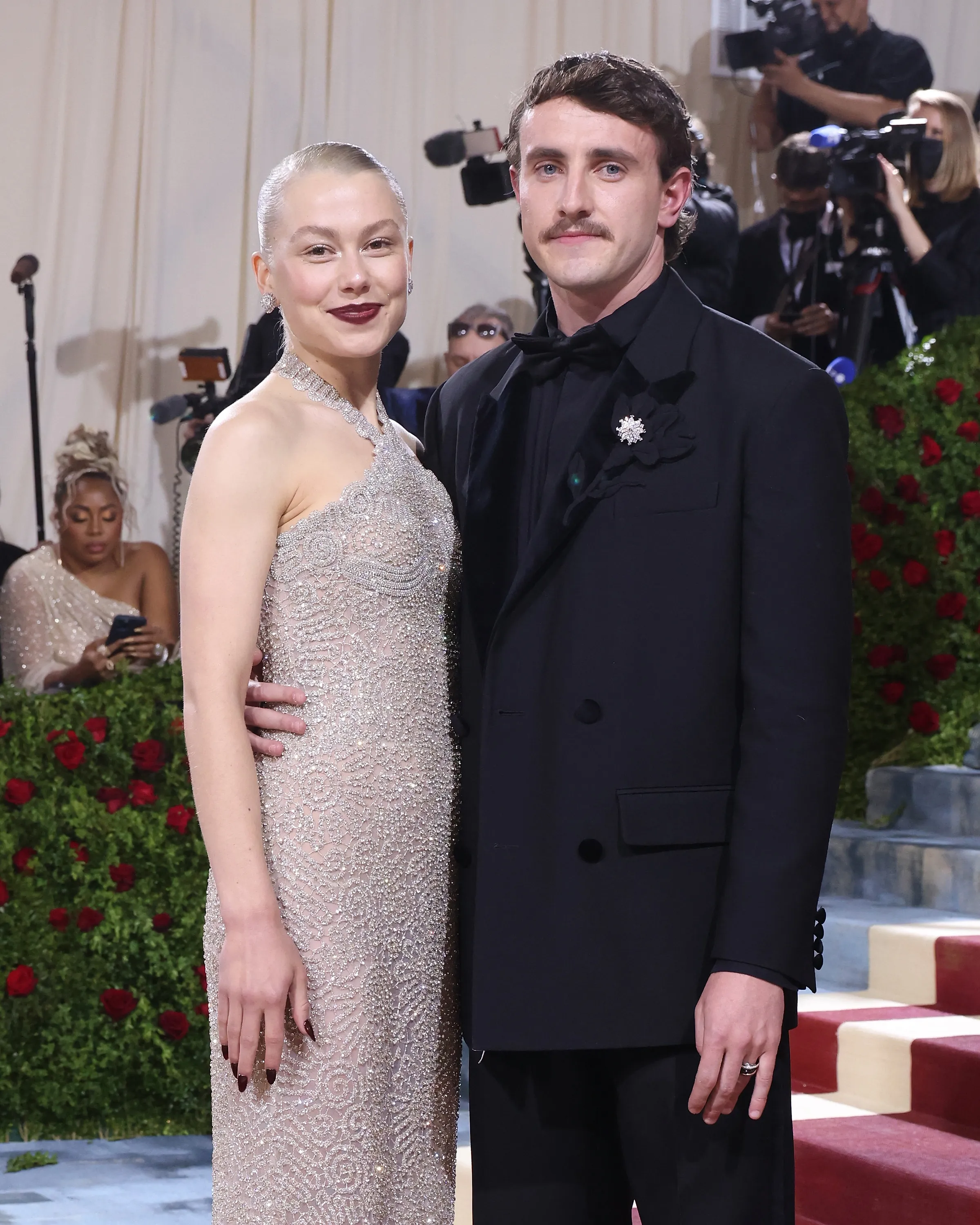 Phoebe Bridgers in a shimmering gown and Paul Mescal in a tuxedo with a mustache at the 2022 Met Gala.