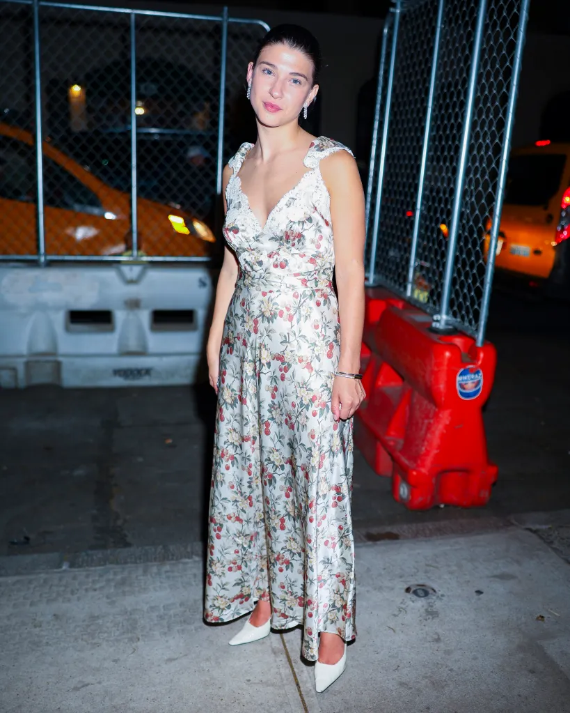 Phoebe Gates wearing a floral print dress.