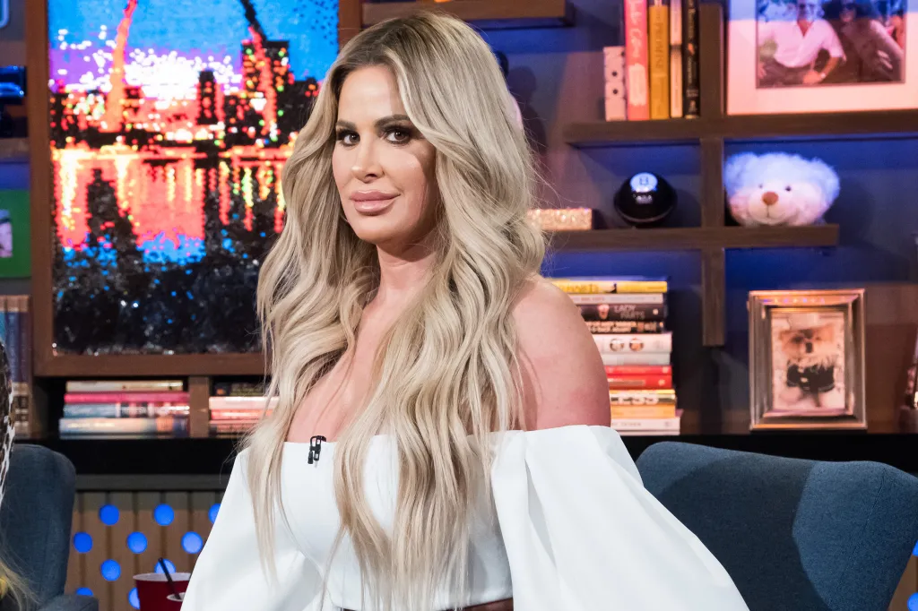 Kim Zolciak-Biermann with long blonde hair, looking at the camera.