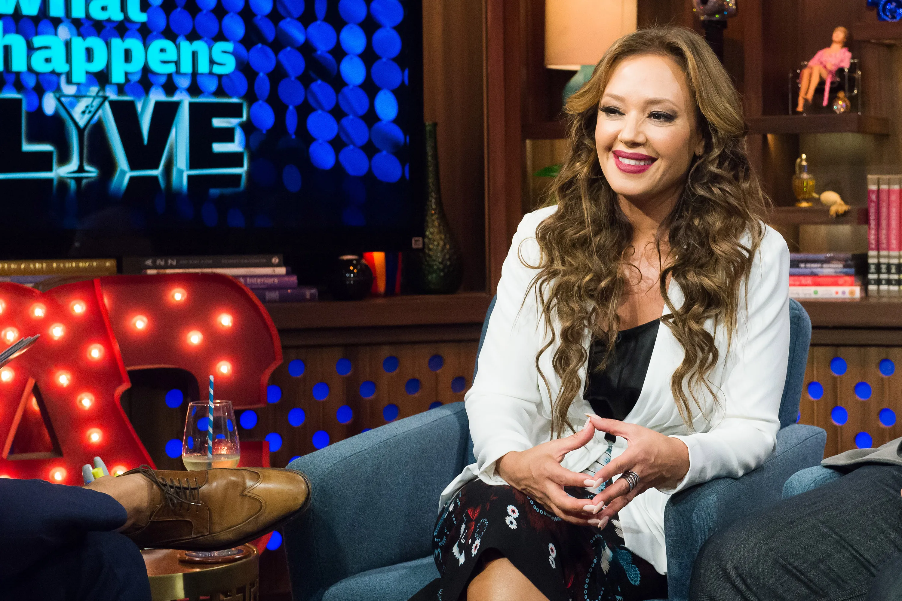 Leah Remini smiling during an appearance on Watch What Happens Live.