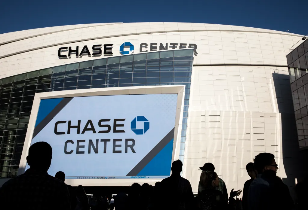 People queue outside the Chase Center in San Francisco to attend a concert.