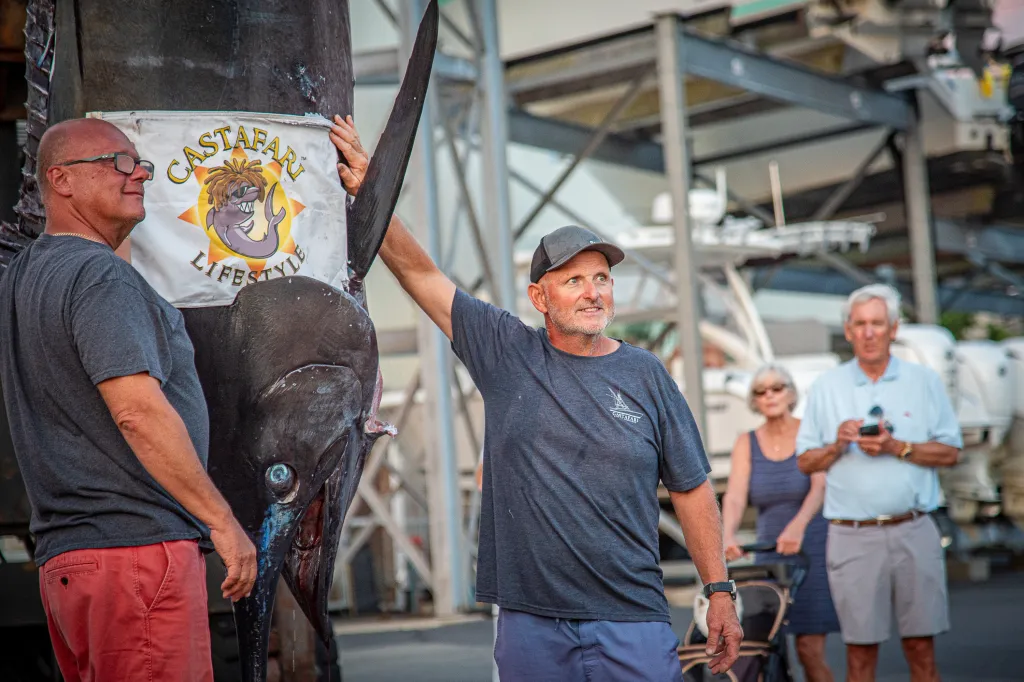 Walter Chapman and Damon Sacco posing with an enormous blue marlin.