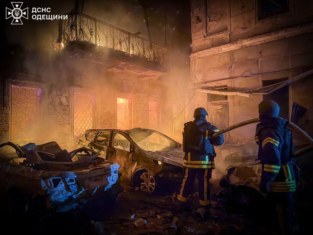 Firefighters extinguish a fire in residential buildings and burnt-out cars after a Russian missile attack in Odesa, Ukraine.