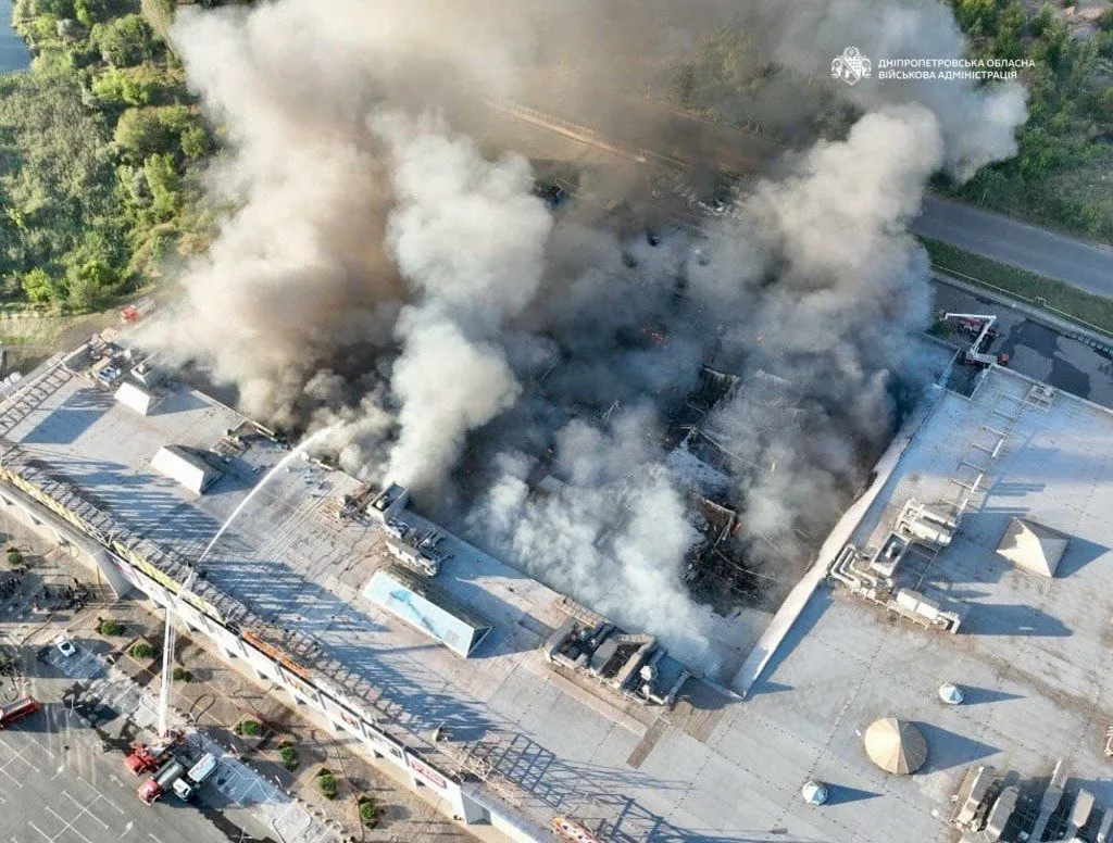Aerial view of firefighters working on a fire at a shopping mall after a drone attack in Kryvyi Rih, Ukraine.