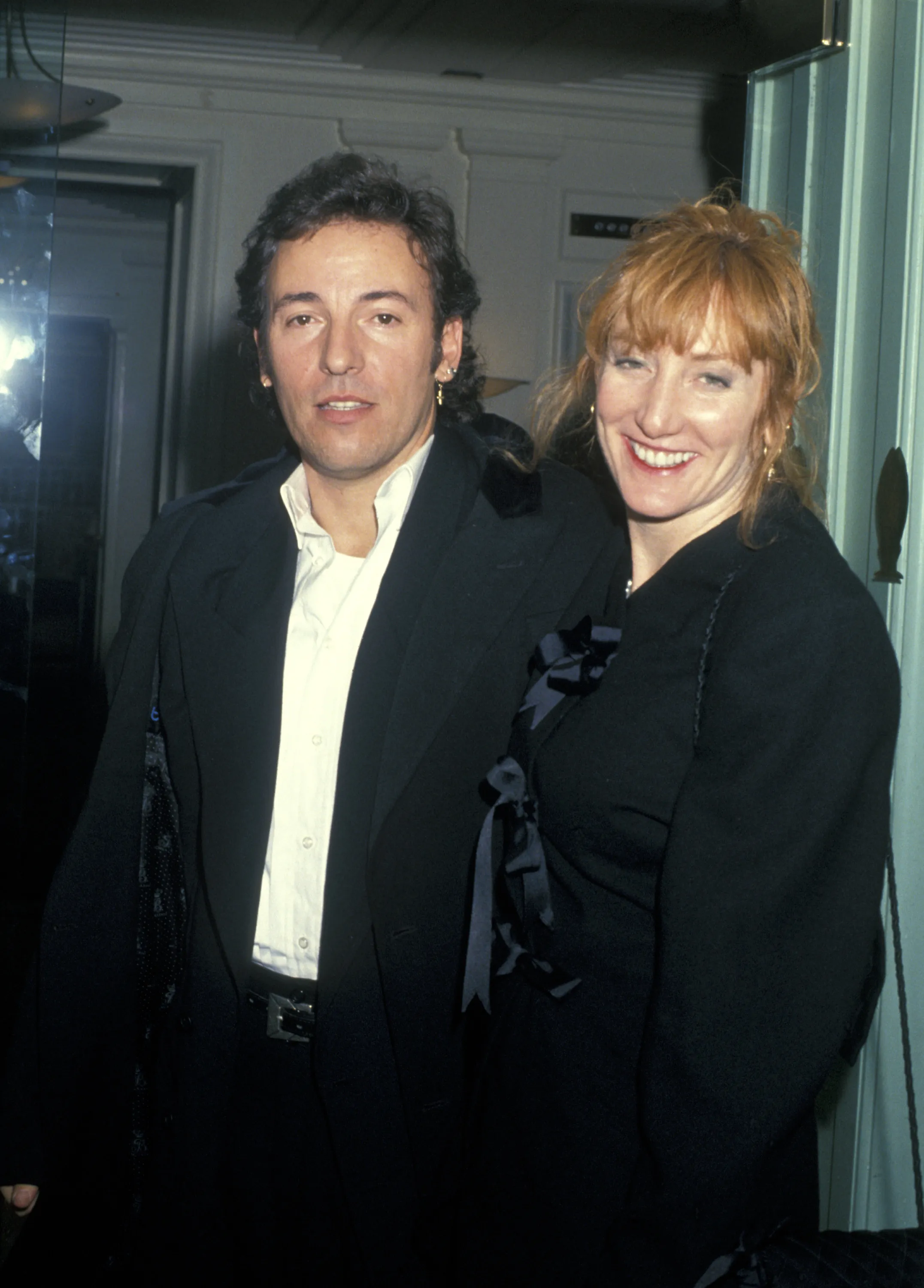 Patti Scialfa and Bruce Springsteen pose together.