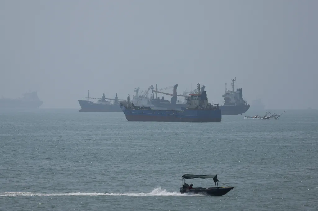 Vessels in the Strait of Hormuz are visible near the beach of Bandar Abbas, Iran.