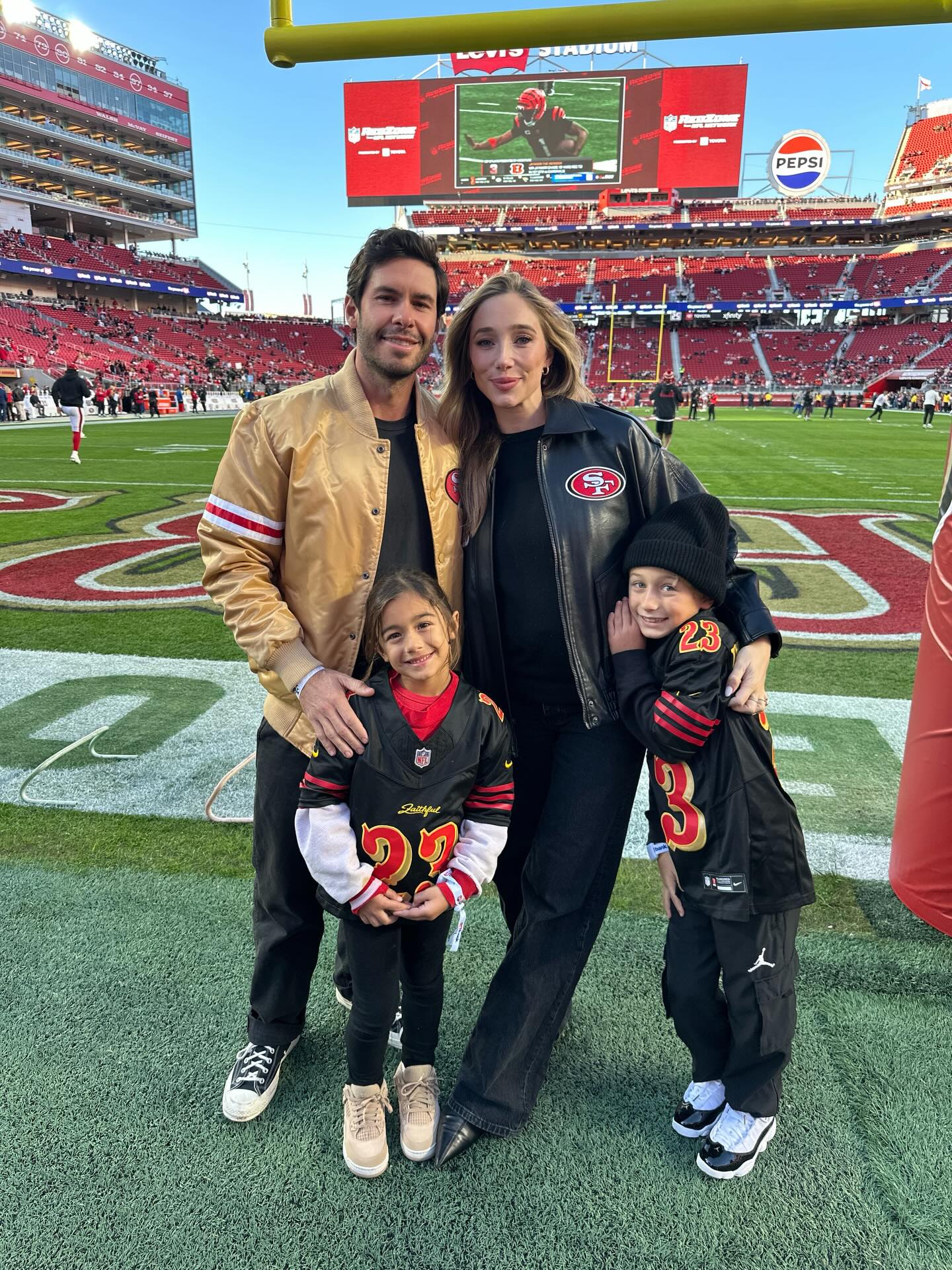Aurora Culpo and her family on a football field.