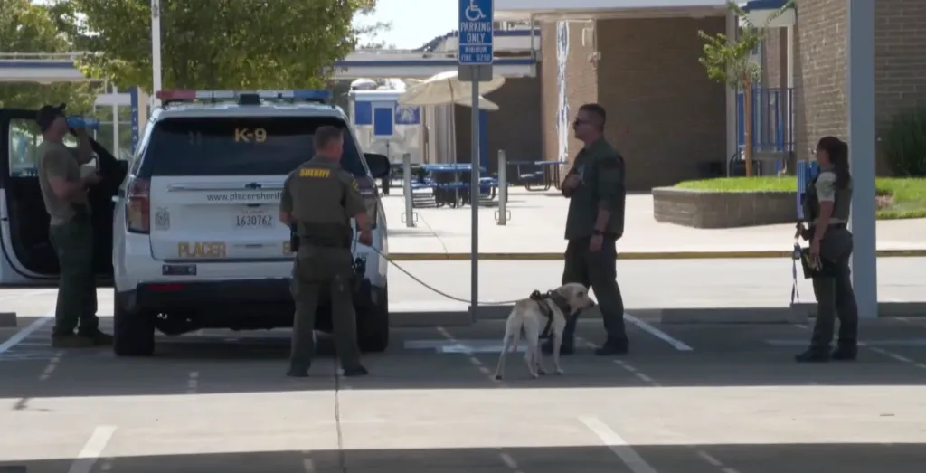 Police and a K-9 unit arrive at Wheatland Union High School after an AI-generated bomb threat.