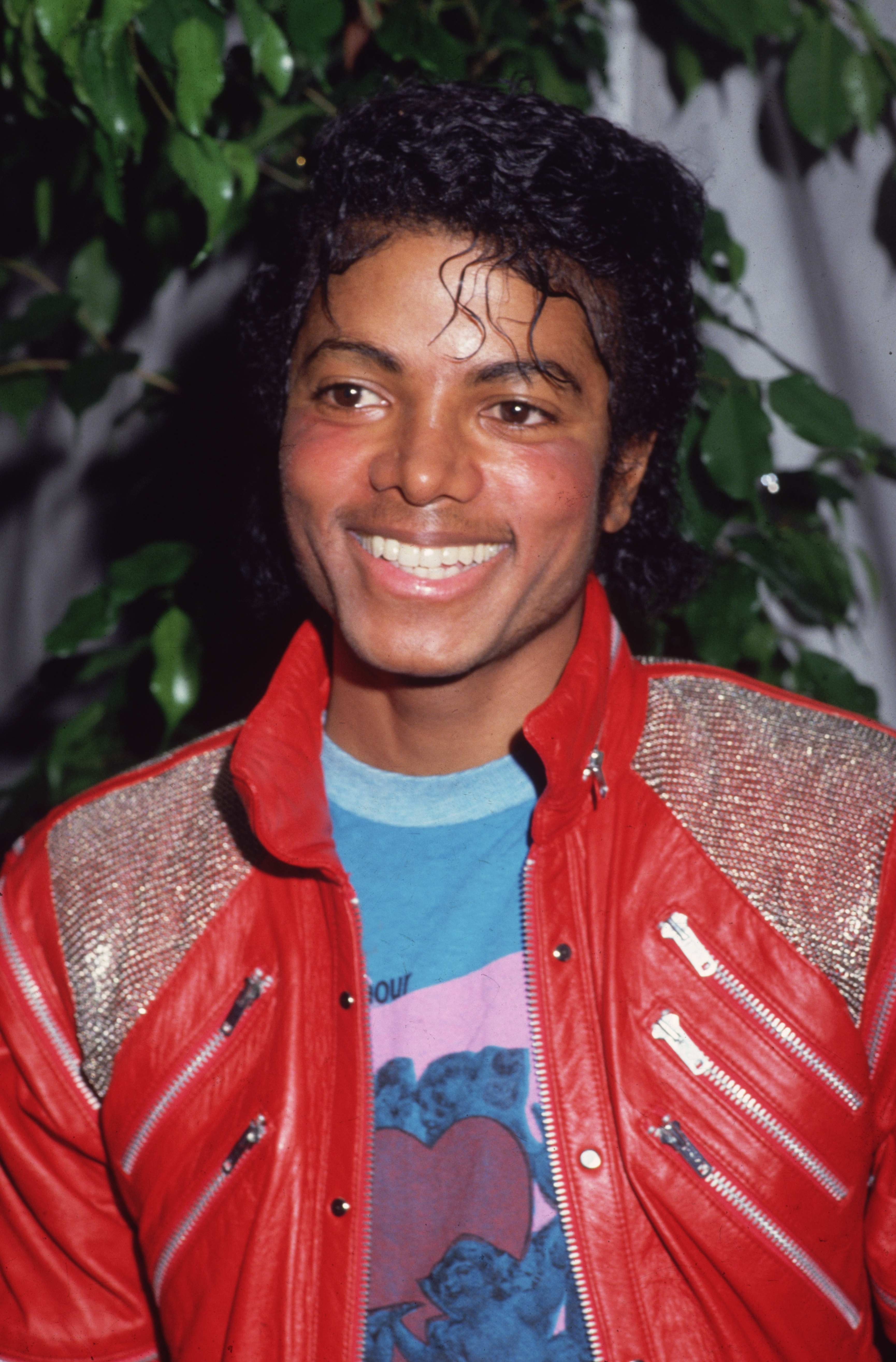 American pop star Michael Jackson wearing a red leather jacket.