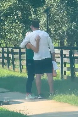 Kroy Biermann and Jillian Green embrace outdoors in Alpharetta.