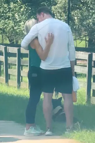 Kroy Biermann and Jillian Green kissing during a hike.