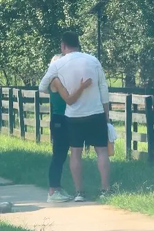 Kroy Biermann and Jillian Green embrace outdoors during a hike.