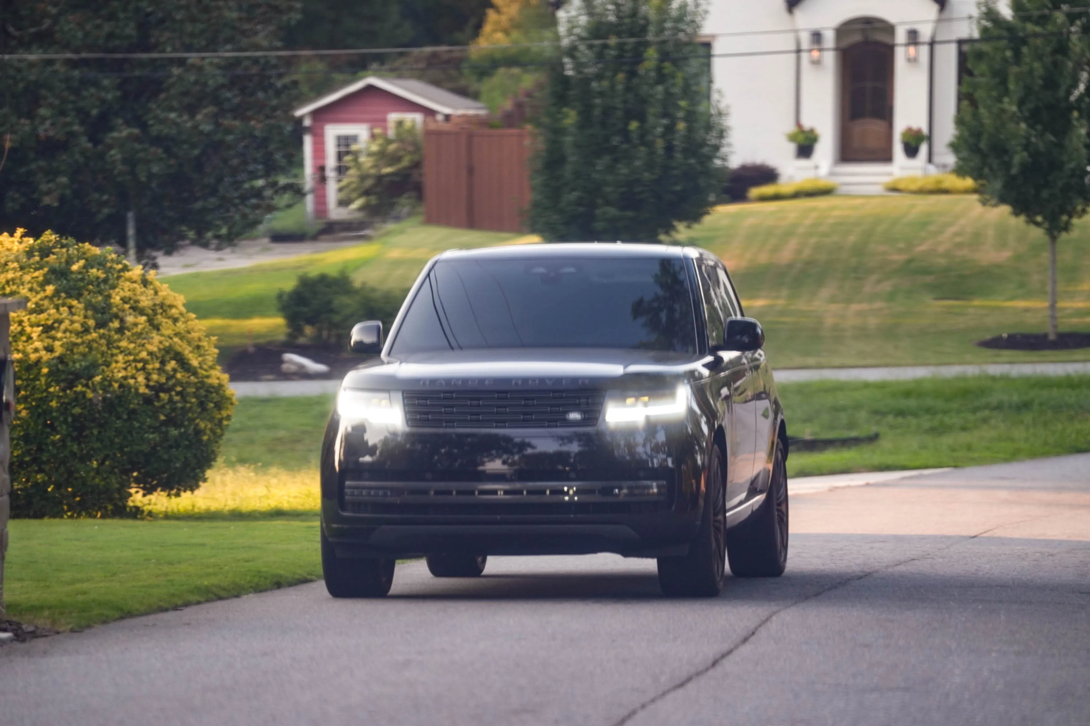 Kim Zolciak driving a black SUV.