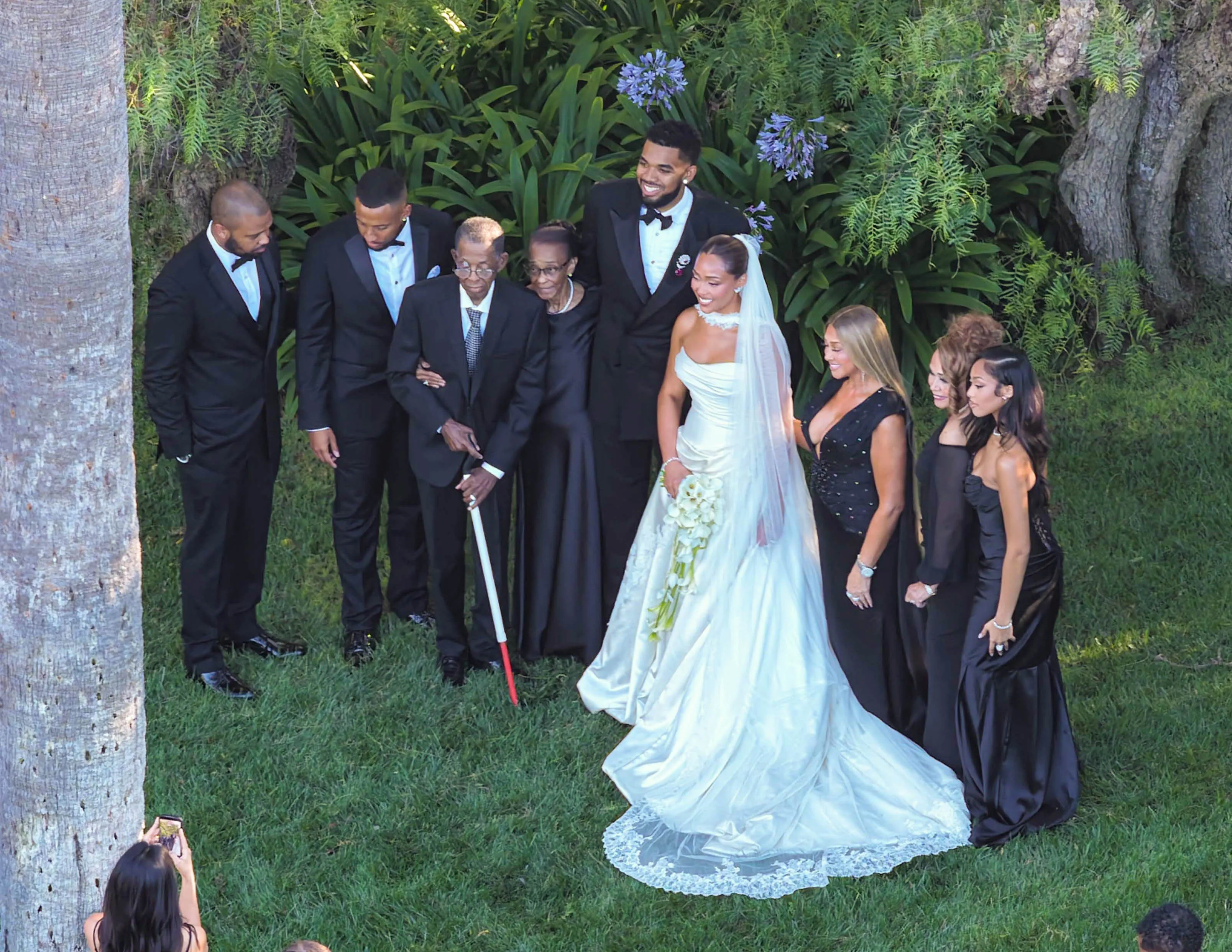 Jordyn Woods and Karl-Anthony Towns with wedding guests.
