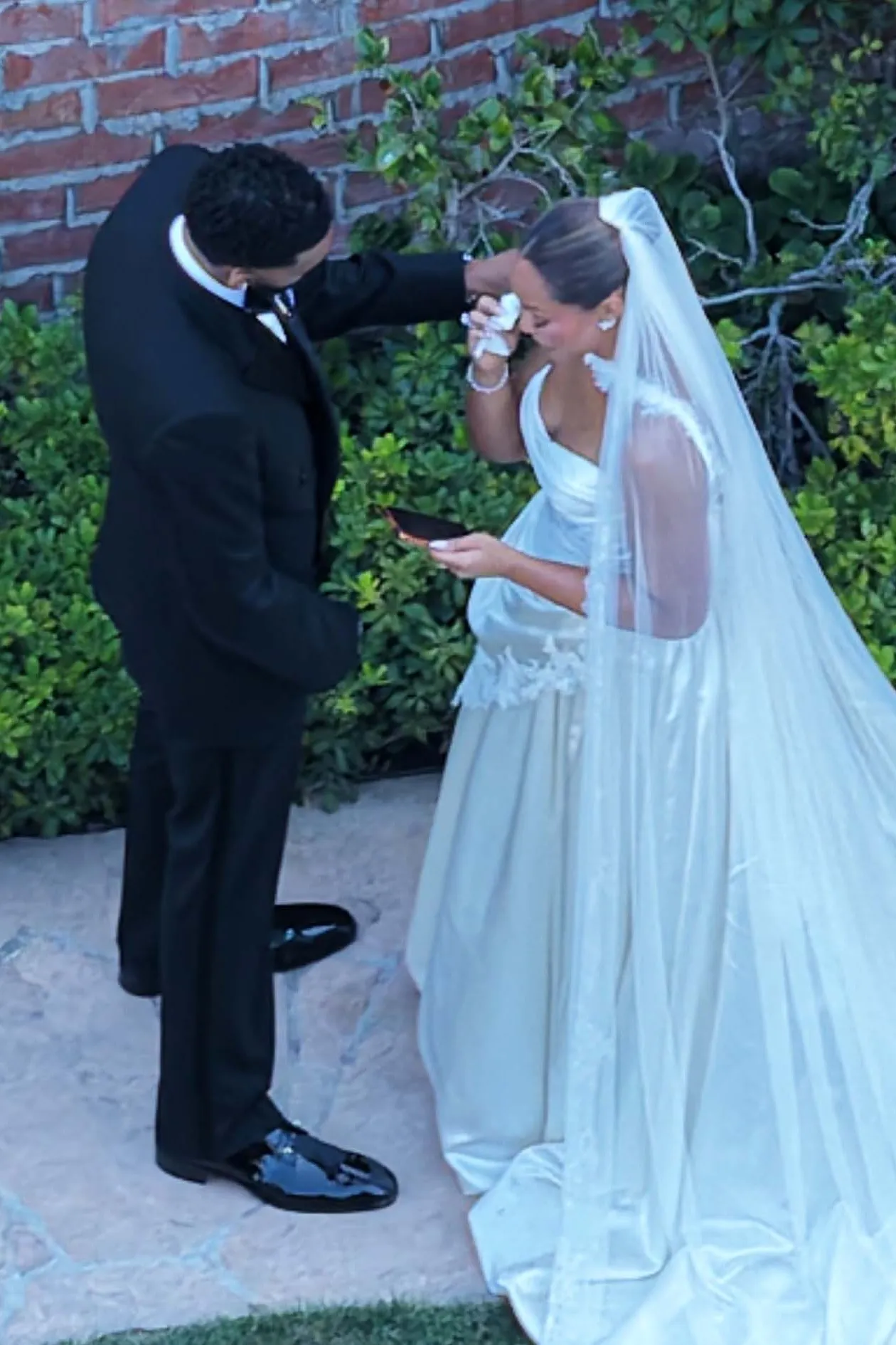 Karl-Anthony Towns wipes Jordyn Woods' tears at their wedding.