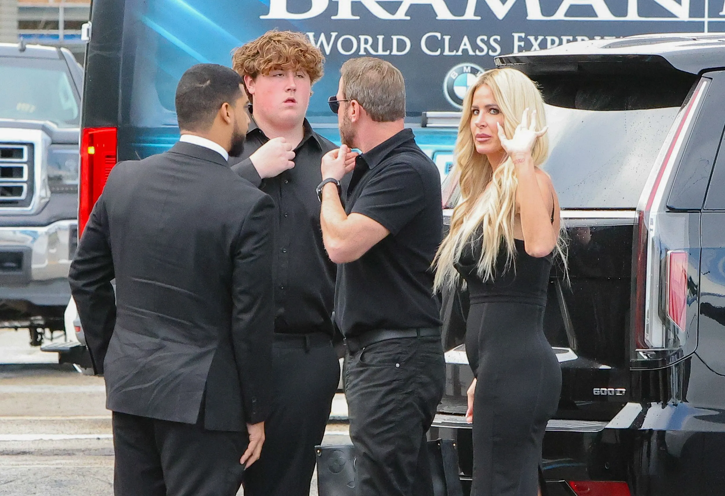 Kim Zolciak, Kyle Mowitz, and Kash leaving a Palm Beach restaurant.