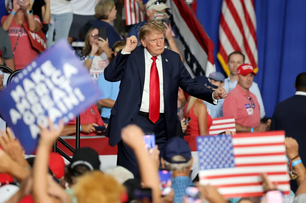 President Donald Trump dances as he departs during a campaign event.