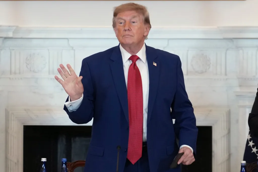 President Donald Trump departing after speaking at a roundtable.
