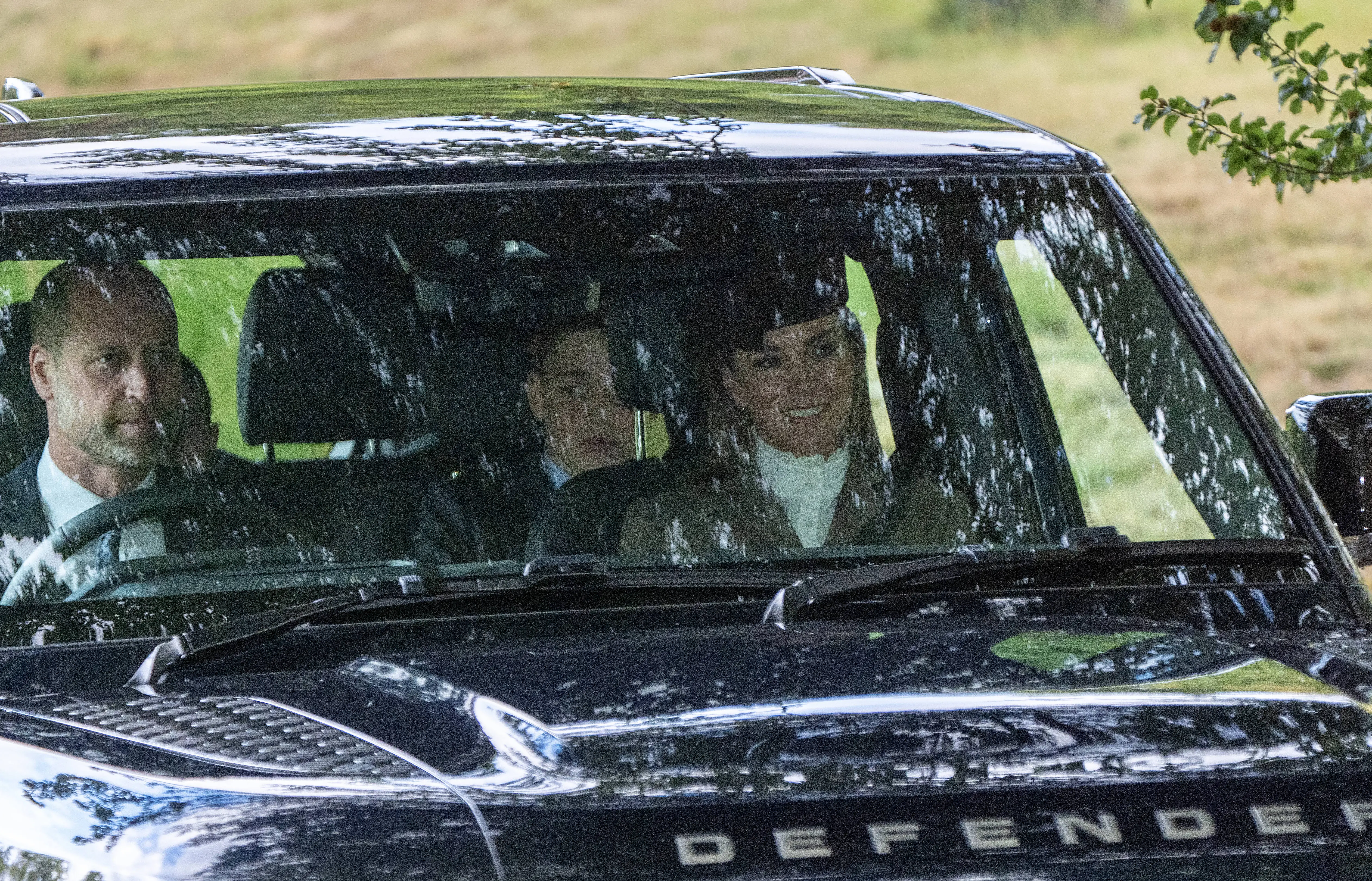 The Prince and Princess of Wales and their son Prince George arrive at a Sunday church service.