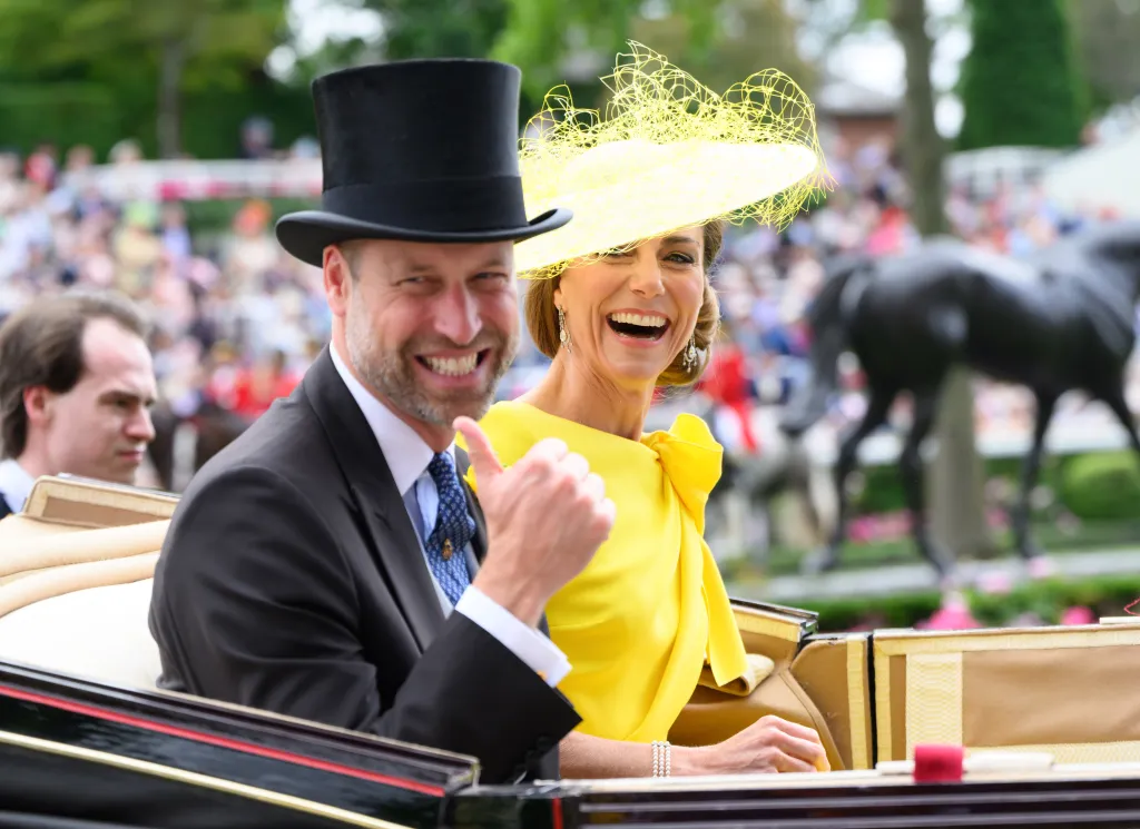 Prince William, Prince of Wales, in a grey morning suit and black top hat, and Catherine, Princess of Wales, in bright yellow dress and yellow hat, laughing at Royal Ascot 2026.