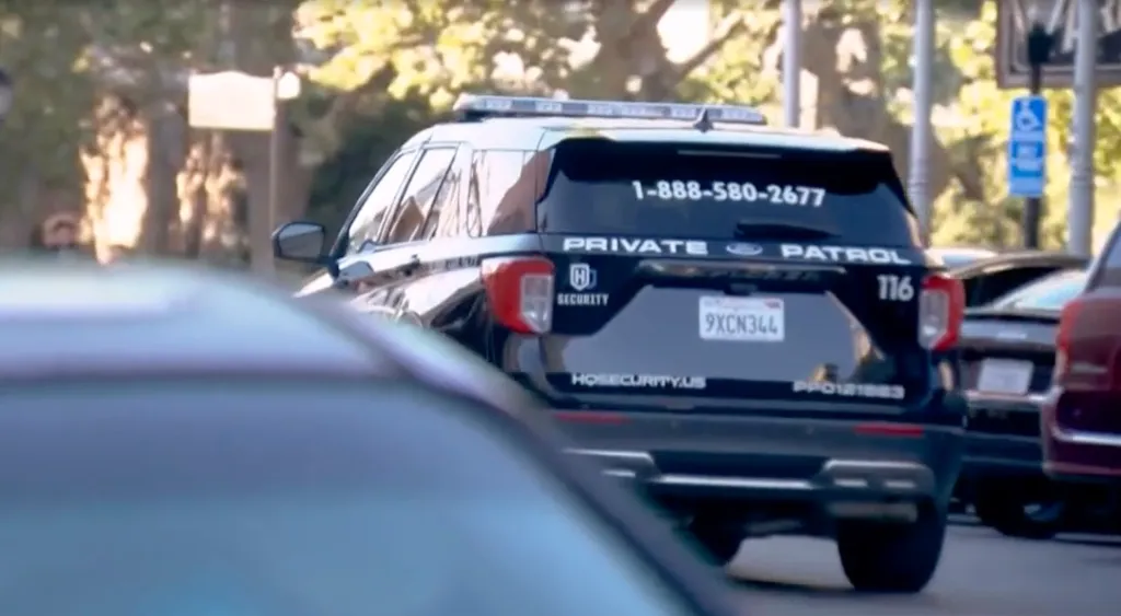 Back of a black private security patrol SUV with
