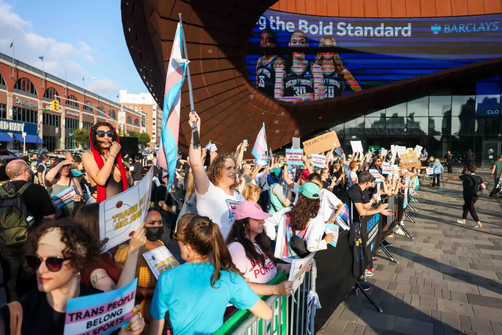 Pro-trans inclusion demonstrators protest outside a WNBA basketball game at the Barclay's Center.