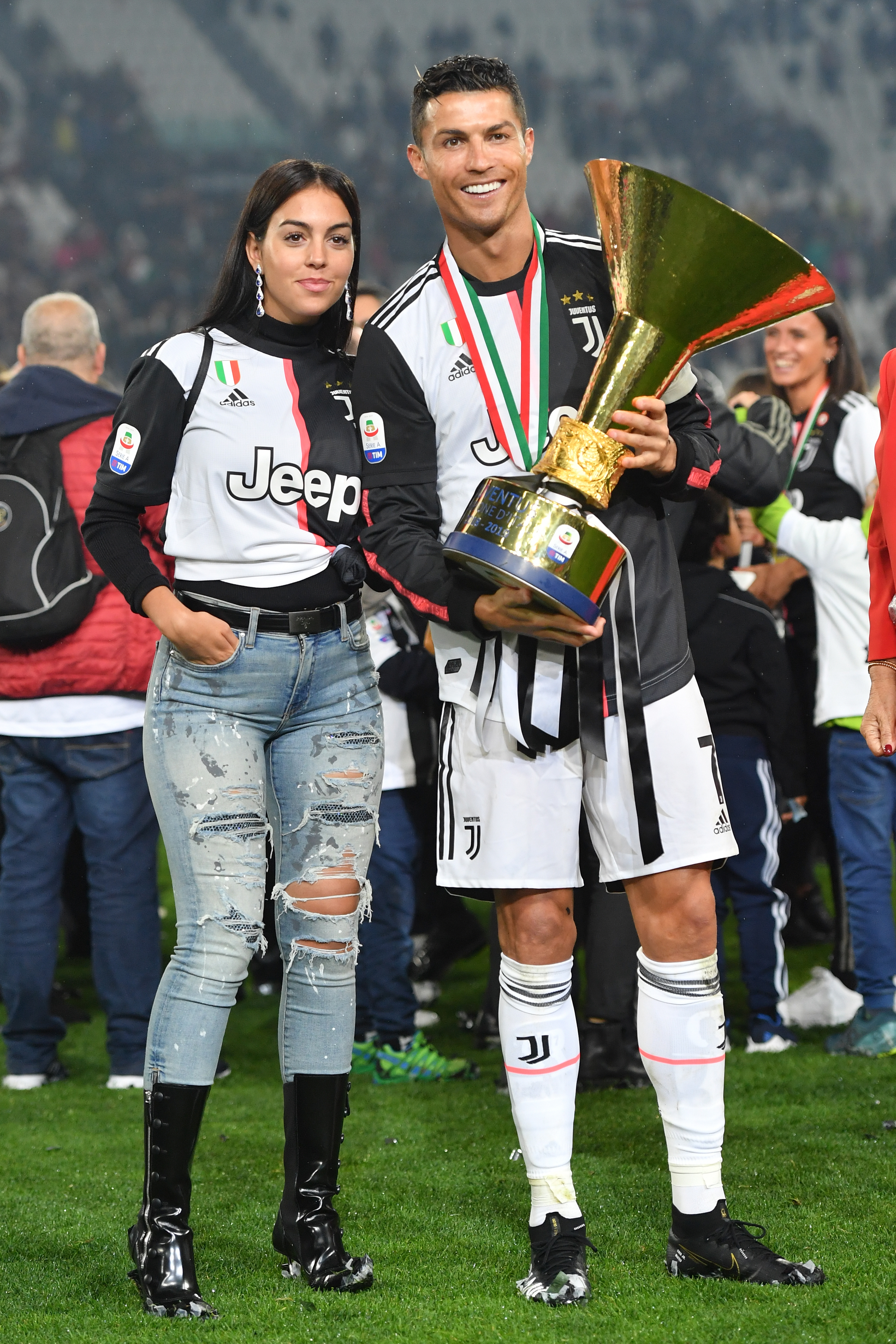 Cristiano Ronaldo and Georgina Rodriguez pose with the Serie A Championship trophy.