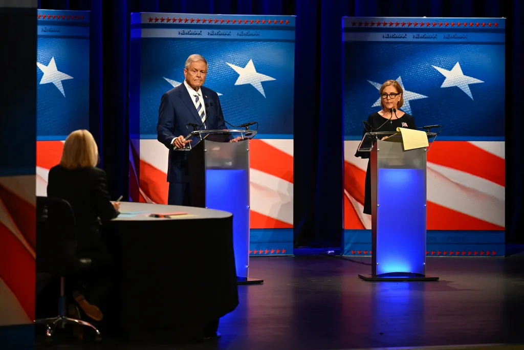 US Senator Darline Graham and US Representative Ralph Norman participate in a televised debate.