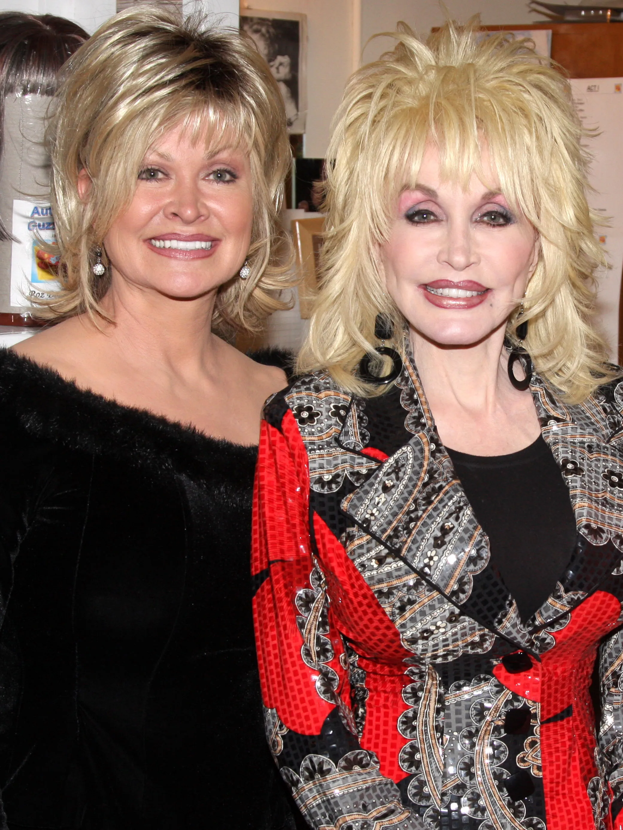 Rachel Parton Dennison and Dolly Parton smiling for a photo.