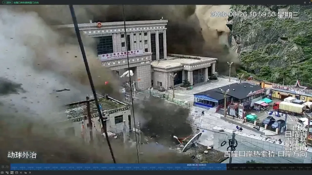 CCTV footage shows people running away from a wall of mud and water destroying buildings at the Nepal-China border.