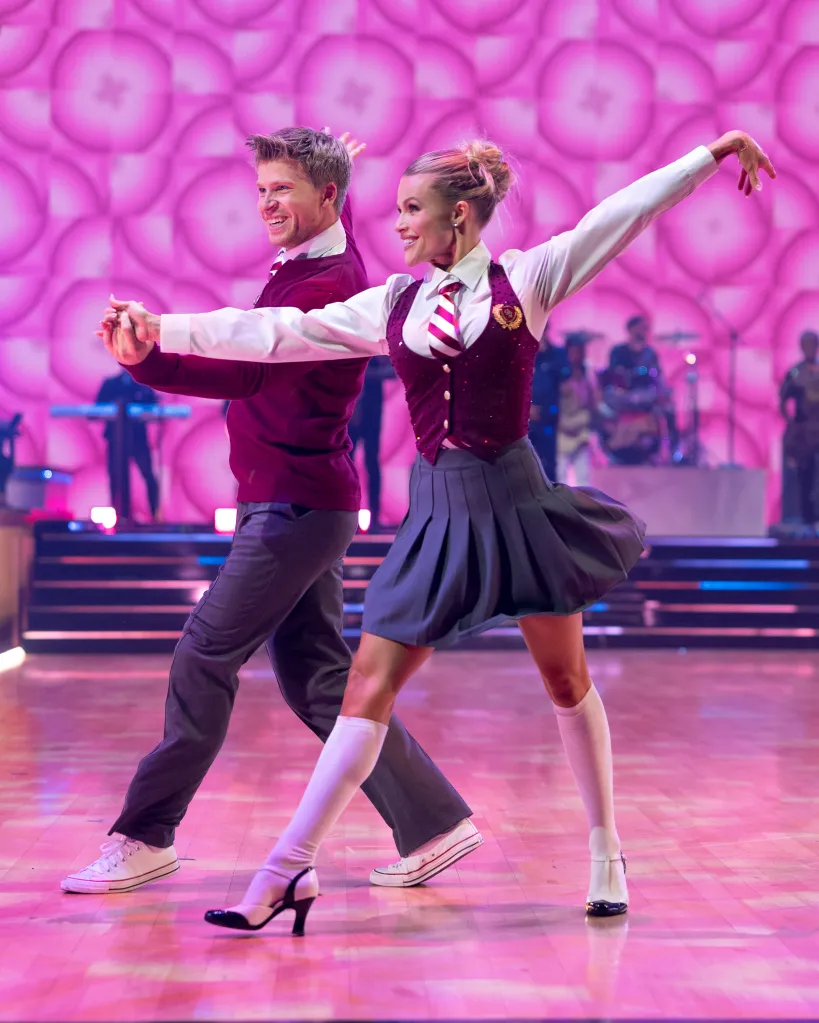 Robert Irwin and Witney Carson dancing in school uniform costumes on 