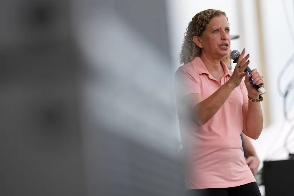 Rep. Debbie Wasserman Schultz speaks into a microphone at a community event.