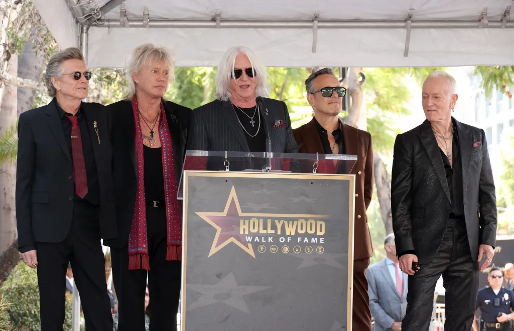 Def Leppard members Rick Allen, Rick Savage, Joe Elliott, Vivian Campbell, and Phil Collen at a Hollywood Walk of Fame ceremony.