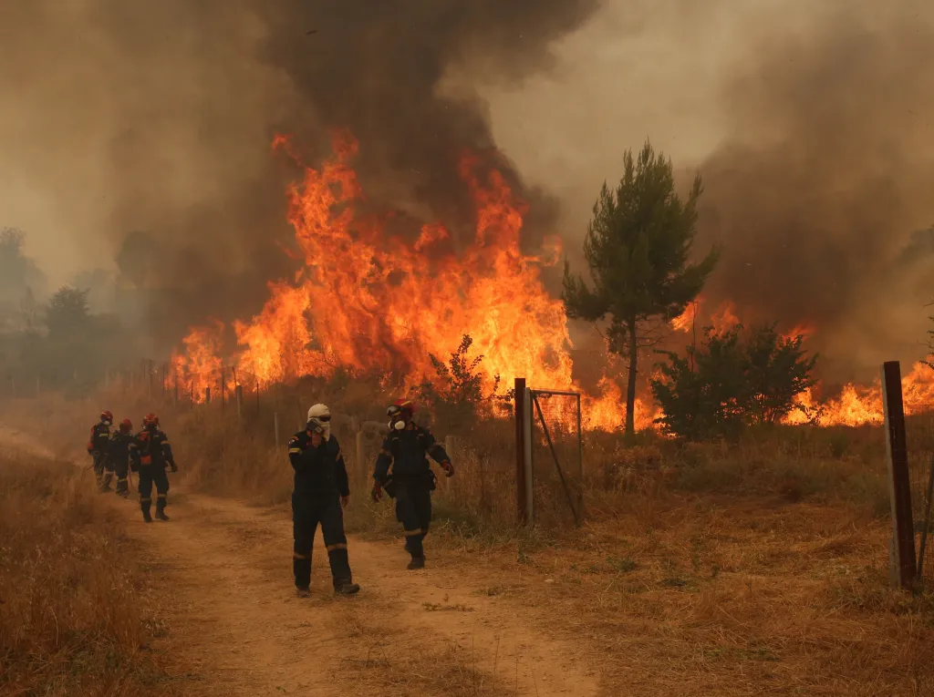Firefighters battling a wildfire in Megara, Attica, Greece.