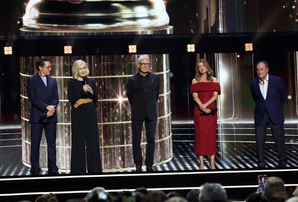 Robert Downey Jr., Diane Sawyer, Harrison Ford, Ellen Pompeo, and Al Michaels speaking onstage at the Disney Entertainment Showcase at D23: Legends.