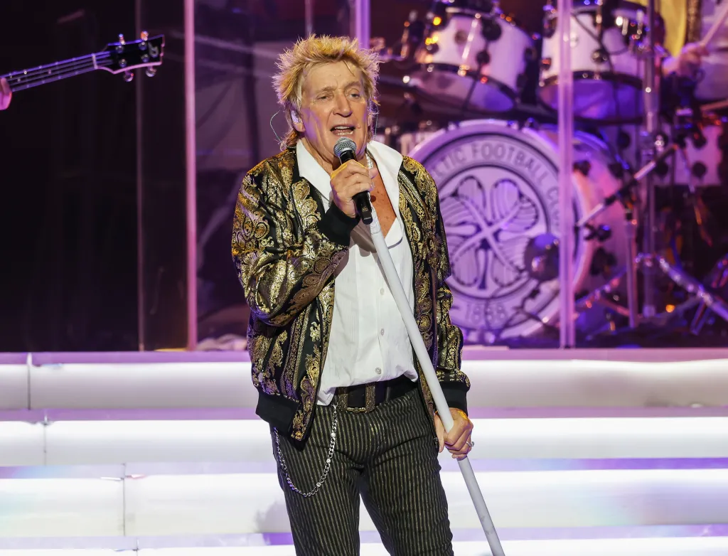 Rod Stewart performing on stage.