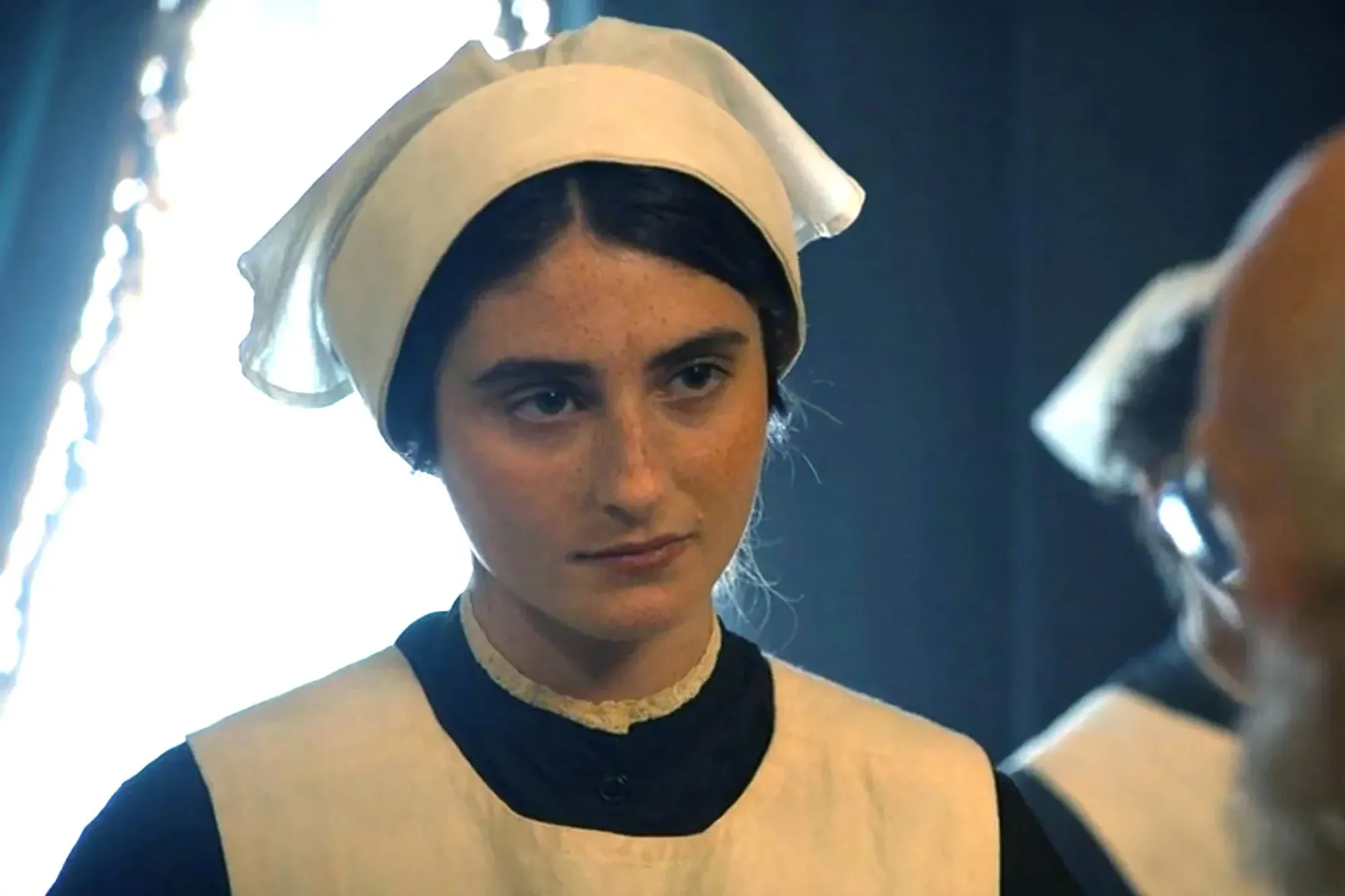 Romy Reiner as an attendant in a period drama.