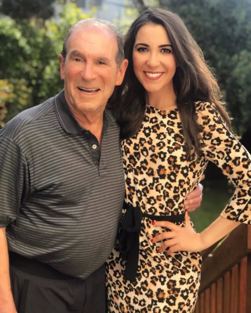 Ronn Owens and his daughter Laura Owens smiling at the camera.